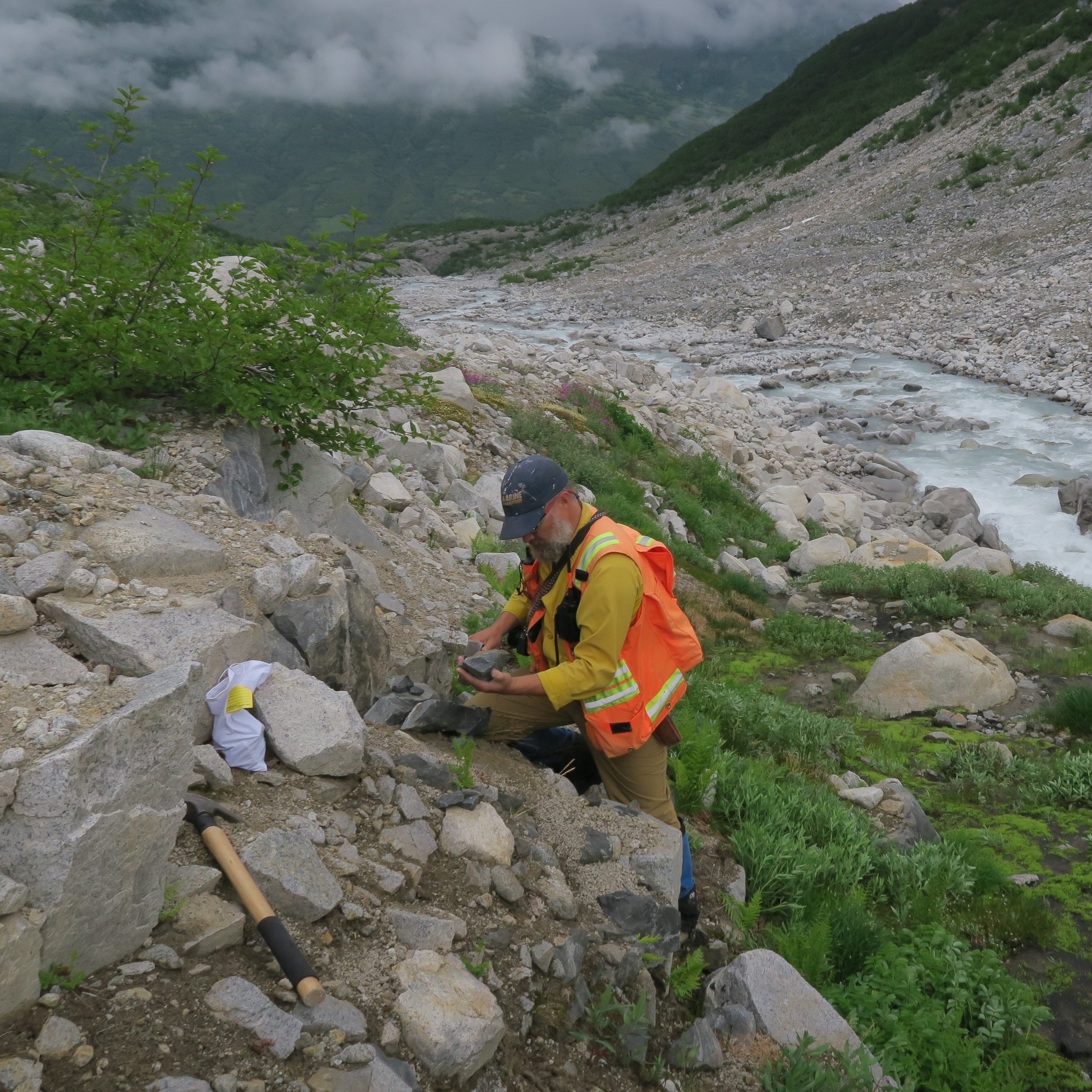 U.S. Geological Survey researchers collecting a soil sample at Lake Clark